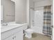 Bright bathroom featuring white fixtures, tile floors, and a shower and tub combination at 520 Cattle Drive Circle, Myrtle Beach, SC 29588