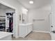Spacious bathroom features a walk-in closet, a large vanity, and updated tile flooring at 520 Cattle Drive Circle, Myrtle Beach, SC 29588