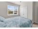 Bedroom features natural light from the window, neutral decor, and a large closet at 520 Cattle Drive Circle, Myrtle Beach, SC 29588