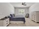 Bedroom with a ceiling fan, a window providing natural light, and a neutral decor at 520 Cattle Drive Circle, Myrtle Beach, SC 29588