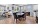 Inviting dining room features a wooden table and chairs with updated gray walls and wood flooring at 520 Cattle Drive Circle, Myrtle Beach, SC 29588