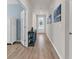 Inviting hallway with beautiful wood floors, neutral paint and decor, leading to the front door at 520 Cattle Drive Circle, Myrtle Beach, SC 29588