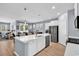 Modern kitchen with stainless steel appliances, a center island, and stylish pendant lighting at 520 Cattle Drive Circle, Myrtle Beach, SC 29588