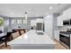Open kitchen with stainless steel appliances, white quartz countertops, a large center island, and pendant lights at 520 Cattle Drive Circle, Myrtle Beach, SC 29588
