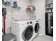A convenient laundry room with washer, dryer, and shelving for organization at 520 Cattle Drive Circle, Myrtle Beach, SC 29588