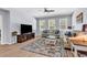Cozy living room with hardwood floors, ample natural light, comfortable seating, and stylish decor at 520 Cattle Drive Circle, Myrtle Beach, SC 29588