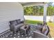Inviting outdoor patio with comfortable seating, privacy fence, and green space at 520 Cattle Drive Circle, Myrtle Beach, SC 29588