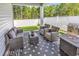 Inviting outdoor patio with comfortable seating, a BBQ grill, and privacy fence at 520 Cattle Drive Circle, Myrtle Beach, SC 29588