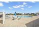 Community pool featuring comfortable lounge chairs and tables with umbrellas at 520 Cattle Drive Circle, Myrtle Beach, SC 29588