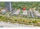 Aerial view of the complex including ocean view, landscaping, and parking at 5601 N Ocean Blvd. # B316, Myrtle Beach, SC 29577