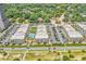 Aerial view of the complex showcasing the pool, palm trees, landscaping, parking, and proximity to the beach at 5601 N Ocean Blvd. # B316, Myrtle Beach, SC 29577