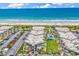 Aerial view of the complex including ocean view, landscaping, and parking at 5601 N Ocean Blvd. # B316, Myrtle Beach, SC 29577