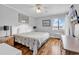 Bright bedroom featuring a queen bed, ceiling fan, and a view of the exterior at 5601 N Ocean Blvd. # B316, Myrtle Beach, SC 29577