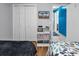 Relaxing bedroom with storage and TV, connecting to a brightly colored hallway at 5601 N Ocean Blvd. # B316, Myrtle Beach, SC 29577
