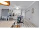 Kitchen with white cabinets, stainless steel appliances, white tile floors, and a central island at 5601 N Ocean Blvd. # B316, Myrtle Beach, SC 29577