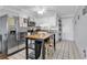 White-cabinet kitchen with stainless steel appliances, an island, and a stainless fridge at 5601 N Ocean Blvd. # B316, Myrtle Beach, SC 29577