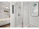 Bathroom featuring shower with glass door, wood-look flooring, and beach-themed decor at 6001-1680 S Kings Hwy., Myrtle Beach, SC 29575
