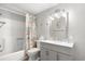 Bright bathroom featuring a tub with flamingo themed shower curtain and grey vanity at 6001-1680 S Kings Hwy., Myrtle Beach, SC 29575