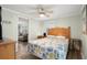 Well-lit bedroom with a ceiling fan and comfortable furnishings at 6001-1680 S Kings Hwy., Myrtle Beach, SC 29575