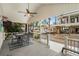 Inviting covered porch with a dining table and chairs, perfect for outdoor entertaining with neighborhood views at 6001-1680 S Kings Hwy., Myrtle Beach, SC 29575