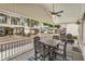 Inviting covered porch with a dining table and chairs, perfect for outdoor entertaining with neighborhood views at 6001-1680 S Kings Hwy., Myrtle Beach, SC 29575