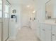 Bathroom with dual sinks, lots of cabinetry, a soaking tub, and a glass shower at 6186 Chadderton Circle, Myrtle Beach, SC 29579