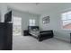 Bedroom with carpeted floors, a bed, and balcony at 6186 Chadderton Circle, Myrtle Beach, SC 29579