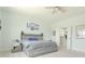 Spacious bedroom featuring a ceiling fan, ensuite bath, and tasteful decor at 6186 Chadderton Circle, Myrtle Beach, SC 29579