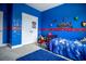 Blue bedroom with fun decor, featuring a cozy twin bed and playful wall decorations, perfect for a  at 6186 Chadderton Circle, Myrtle Beach, SC 29579