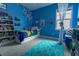 Cheerful blue bedroom with playful wall decor, plush carpeting, and a whimsical canopy bed at 6186 Chadderton Circle, Myrtle Beach, SC 29579