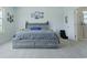 Bright bedroom with a bed, carpeted floors, and ensuite bathroom at 6186 Chadderton Circle, Myrtle Beach, SC 29579
