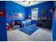 Vibrant blue bedroom with playful decor and cozy furnishings offers a fun and inviting space for children at 6186 Chadderton Circle, Myrtle Beach, SC 29579