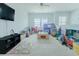 Large bonus room provides ample space for recreation and entertainment, with bright windows and carpeted flooring at 6186 Chadderton Circle, Myrtle Beach, SC 29579