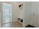 Practical entryway boasts built-in bench with storage, hooks, and open access to a brightly lit room at 6186 Chadderton Circle, Myrtle Beach, SC 29579