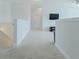 Spacious hallway on upper level featuring plush neutral carpeting and modern lighting perfect for versatile living at 6186 Chadderton Circle, Myrtle Beach, SC 29579