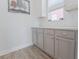 Neutral kitchen features gray cabinets, white subway tile backsplash and view to the neighborhood at 6186 Chadderton Circle, Myrtle Beach, SC 29579
