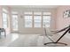 Bright living area with serene water views, featuring a cozy hammock and neutral-toned decor at 6186 Chadderton Circle, Myrtle Beach, SC 29579