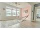 Sunroom with bright natural light, hammock, and wood-look flooring at 6186 Chadderton Circle, Myrtle Beach, SC 29579