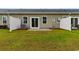 Exterior view of a backyard with new sod, patio, and privacy fence at 623 Harrison Mill St. # 623, Myrtle Beach, SC 29579