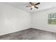 Bedroom with ceiling fan, window, and luxury vinyl plank flooring at 623 Harrison Mill St. # 623, Myrtle Beach, SC 29579