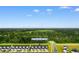 New townhomes showcasing neat landscaping with lush green space in the background at 623 Harrison Mill St. # 623, Myrtle Beach, SC 29579