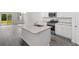Open-concept kitchen with stainless steel appliances, granite countertops, and island sink at 623 Harrison Mill St. # 623, Myrtle Beach, SC 29579