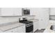 Stylish kitchen with granite countertops, stainless steel oven, and white cabinets at 623 Harrison Mill St. # 623, Myrtle Beach, SC 29579