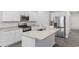 Bright kitchen featuring white cabinets, granite counters, and stainless steel appliances at 623 Harrison Mill St. # 623, Myrtle Beach, SC 29579
