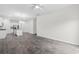 Open-concept living room and kitchen with stainless appliances, an island, and vinyl plank flooring at 623 Harrison Mill St. # 623, Myrtle Beach, SC 29579