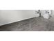 Spacious living room featuring luxury vinyl plank flooring, white walls, and natural light at 623 Harrison Mill St. # 623, Myrtle Beach, SC 29579