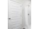 Bathroom featuring a white tiled shower and a door with a chrome handle at 623 Harrison Mill St. # 623, Myrtle Beach, SC 29579