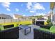 Landscaped backyard featuring outdoor seating, a grill, and a well-maintained lawn, perfect for entertaining at 6304 Chadderton Circle, Myrtle Beach, SC 29579