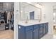 Stylish bathroom with a double vanity, modern fixtures, and a walk-in closet with custom shelving at 6304 Chadderton Circle, Myrtle Beach, SC 29579