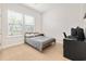 Bedroom with a neutral color scheme, a full-sized bed, and a bright window for natural light at 6304 Chadderton Circle, Myrtle Beach, SC 29579